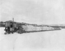 Caterpillar hauling freight on the lake in spring to the Yukon, between c1900 and c1930. Creator: Unknown