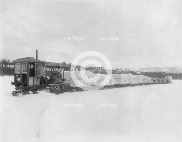 Caterpillar hauling freight on the lake in spring to the Yukon, between c1900 and c1930. Creator: Unknown.