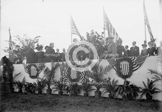 Cavalry Review By President Wilson - Seen In Stand: President Wilson; General Wood; Col..., 1913. Creator: Harris & Ewing.