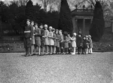 Cavendish family group of 16 grandchildren in the gardens of Chatsworth, Derbyshire, Christmas 1929. Creator: JR Board