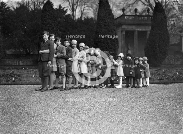 Cavendish family group of 16 grandchildren in the gardens of Chatsworth, Derbyshire, Christmas 1929. Creator: JR Board.