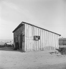 Cabin which rents for ten dollars a month in Arkansawyer's auto camp, Greenfield, CA, 1939. Creator: Dorothea Lange
