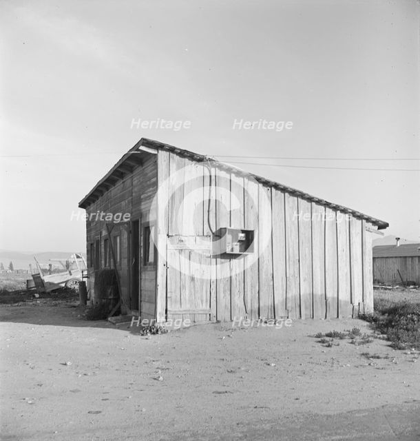 Cabin which rents for ten dollars a month in Arkansawyer's auto camp, Greenfield, CA, 1939. Creator: Dorothea Lange.