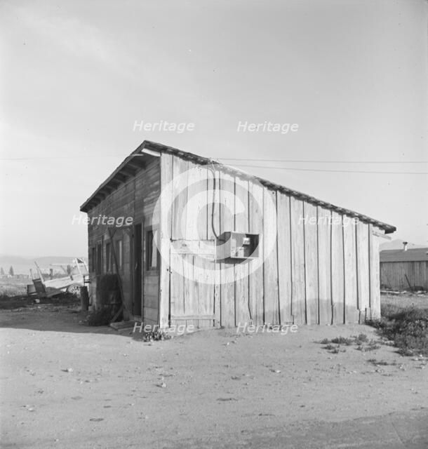 Cabin which rents for ten dollars a month in Arkansawyer's auto camp, Greenfield, CA, 1939. Creator: Dorothea Lange.