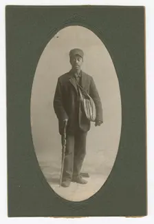 Cabinet card of a newspaper carrier, mid to late 19th century. Creator: Unknown
