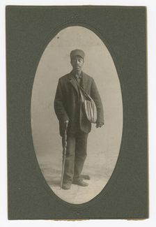 Cabinet card of a newspaper carrier, mid to late 19th century. Creator: Unknown