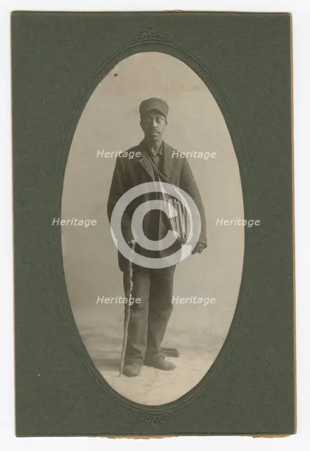 Cabinet card of a newspaper carrier, mid to late 19th century. Creator: Unknown.