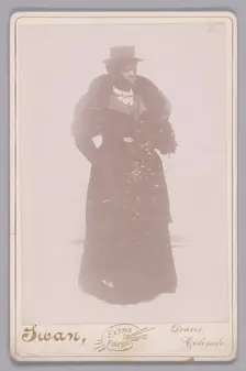 Cabinet card of an unidentified woman wearing a top hat and a fur stole, ca. 1895. Creator: Justus C. Swan