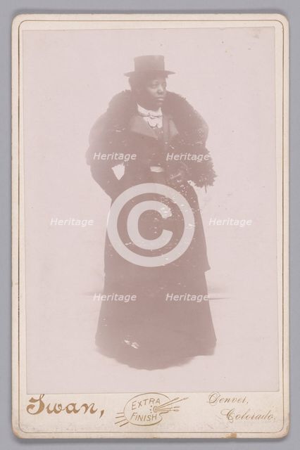 Cabinet card of an unidentified woman wearing a top hat and a fur stole, ca. 1895. Creator: Justus C. Swan.