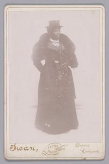 Cabinet card of an unidentified woman wearing a top hat and a fur stole, ca. 1895. Creator: Justus C. Swan