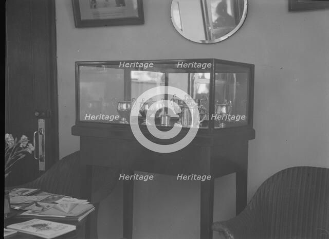 Cabinet containing motor racing trophies. Artist: Bill Brunell.