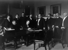 Cabinet Room, White House, Aug. 12, 1898. Secy. of State William R. Day signing, c1898. Creator: Frances Benjamin Johnston