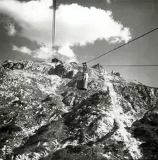 Cable car going up to Tondi di Faloria above Cortina, Dolomites, Italy, c1955. Creator: Arthur Charles Kirby Ware