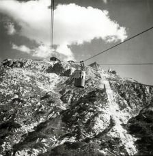 Cable car going up to Tondi di Faloria above Cortina, Dolomites, Italy, c1955. Creator: Arthur Charles Kirby Ware