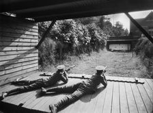 Cadets in the Officer Training Corps using the rifle range, Reading School, Berkshire, 1920-1939. Artist: Marshall Keene and Company