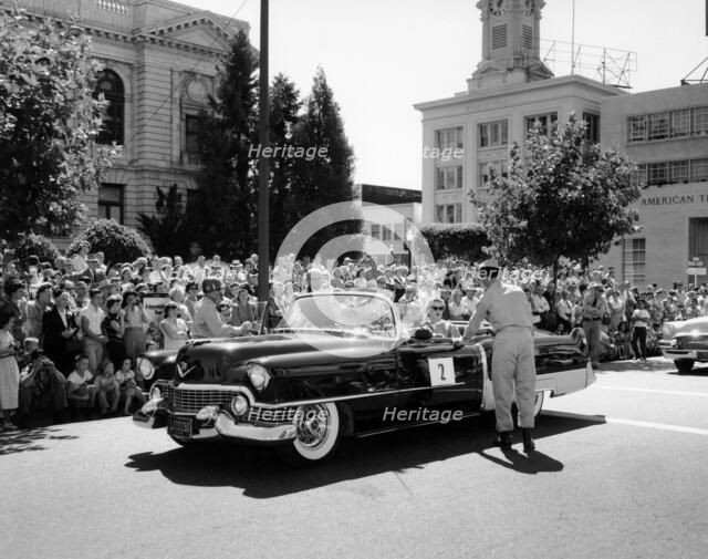 Cadillac convertible in a street parade, USA, (c1958?). Artist: Unknown