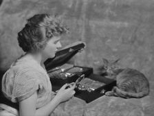 Cadmus, Miss, with Buzzer the cat, portrait photograph, 1914 Apr. 24. Creator: Arnold Genthe