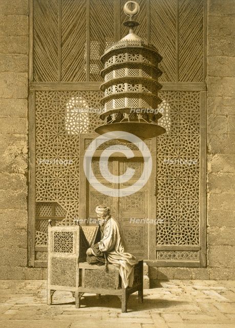 Cairo: Funerary or Sepuchral Mosque of Sultan Barquoq seated Imam reading the Koran, before a pierce Creator: Emile Prisse d'Avennes (1807-79).