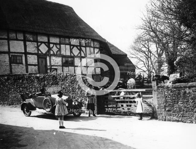 Calcott 2-seater car parked outside a farm gate, c1921-c1922. Artist: Unknown