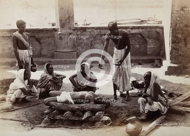 Calcutta, West Bengal: a man about to scatter material from a bowl on a dead body..., c1880s. Creator: Unknown.