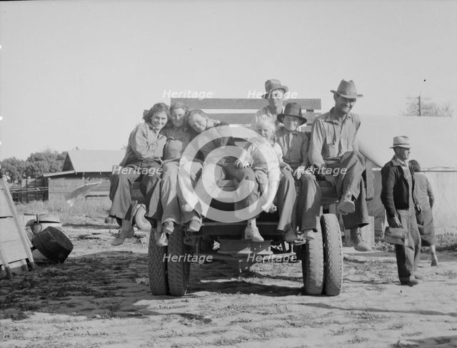 California pea pickers returning to camp..., near Santa Clara, California, 1937. Creator: Dorothea Lange.
