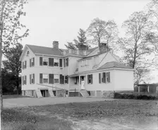 Calloway residence, back, showing porch with woman, Mamaroneck, N.Y., between 1900 and 1915. Creator: William H. Jackson