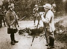 Cameraman filming a wounded soldier, Somme campaign, France, World War I, 1916