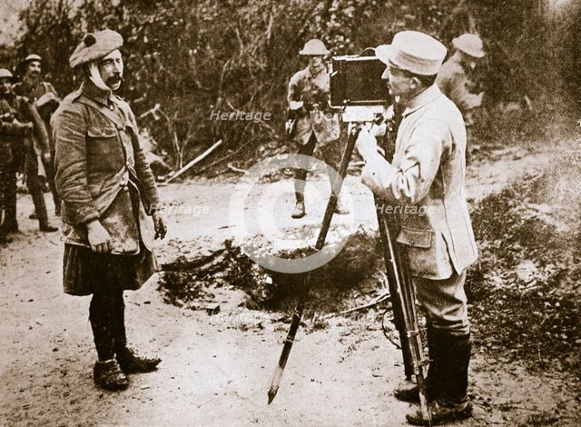 Cameraman filming a wounded soldier, Somme campaign, France, World War I, 1916. Creator: Unknown.