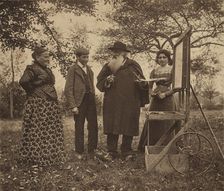Camille Pissarro, Julie, Jeanne and Ludovic-Rodo at an easel in the orchard, c1890s. Creator: Unknown