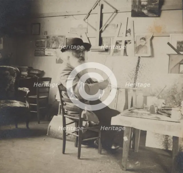 Camille Pissarro painting in his studio, c1860-1903. Creator: Unknown.