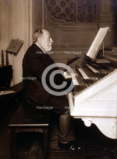 Camille Saint-Saens (1835 - 1921), French composer, photography playing the organ.