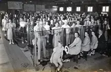 Camouflage net making, Kelvin Grove Drill Hall (now Z 10), Brisbane, 1941. Creator: Isabel Bain