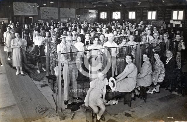 Camouflage net making, Kelvin Grove Drill Hall (now Z 10), Brisbane, 1941. Creator: Isabel Bain.
