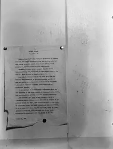 Camp bulletin board in Shafter camp for migratory workers, FSA camp, California, 1938. Creator: Dorothea Lange