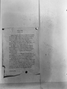 Camp bulletin board in Shafter camp for migratory workers, FSA camp, California, 1938. Creator: Dorothea Lange