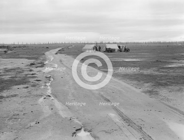 Camp of two related families seen from U.S. 99., Kern County, California, 1939. Creator: Dorothea Lange.