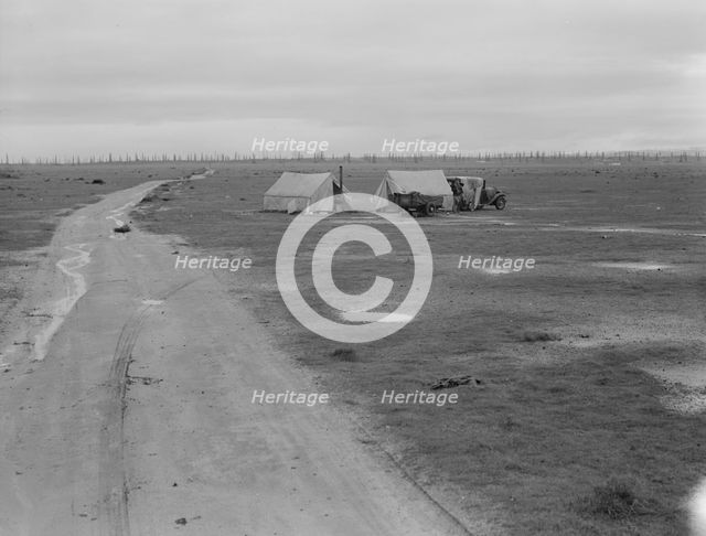 Camp of two related families seen from U.S. 99., Kern County, California, 1939. Creator: Dorothea Lange.
