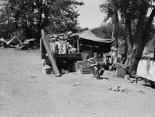 Camp of family with nine children...on the road for three years, Washington, Yakima Valley, 1939. Creator: Dorothea Lange