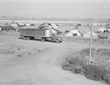 Camp of migrant potato pickers seen from potato shed..., Tulelake, Siskiyou County, California, 1939 Creator: Dorothea Lange