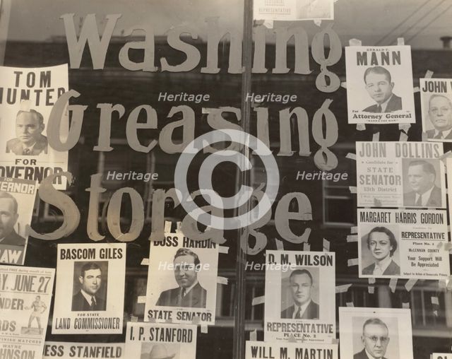 Campaign posters in garage window, just before the primary. Waco, Texas,  1938-06. Creator: Dorothea Lange.
