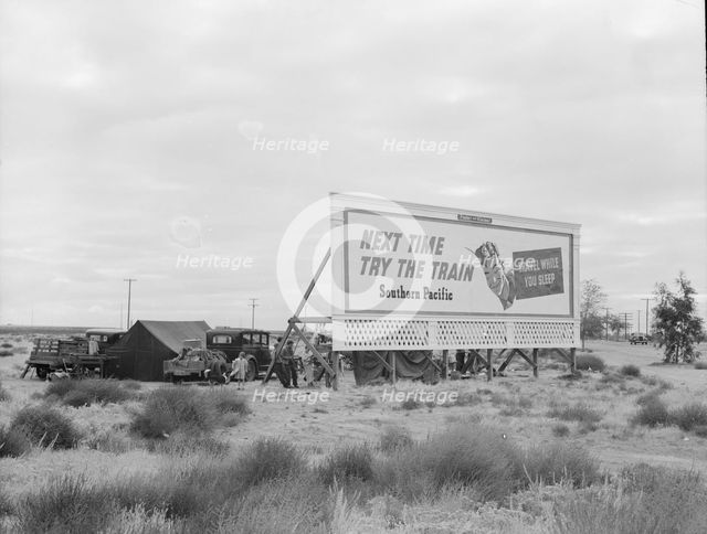 Camped in the rain behind billboard...on U.S. 99, near Famosa, Kern County, California, 1939. Creator: Dorothea Lange.