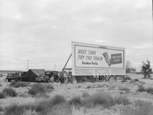 Camped in the rain behind billboard...on U.S. 99, near Famosa, Kern County, California, 1939. Creator: Dorothea Lange