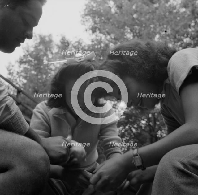 Campers helping with the kitchen work at Camp Ellen Marvin, Arden, New York, 1943. Creator: Gordon Parks.