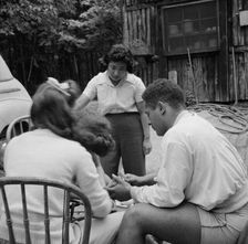 Campers helping with the kitchen work at Camp Ellen Marvin, Arden, New York, 1943. Creator: Gordon Parks