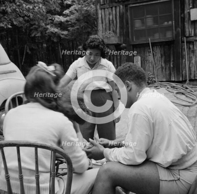 Campers helping with the kitchen work at Camp Ellen Marvin, Arden, New York, 1943. Creator: Gordon Parks.