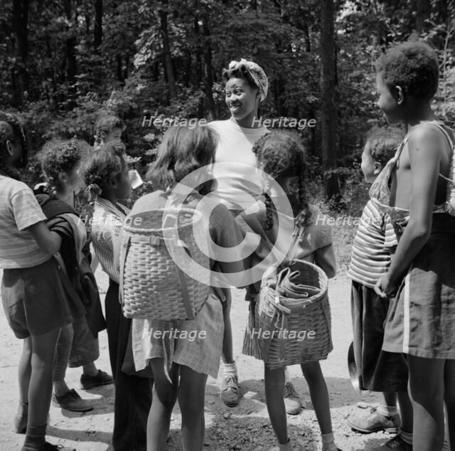 Campers hiking at Camp Fern Rock, Bear Mountain, New York, 1943. Creator: Gordon Parks.