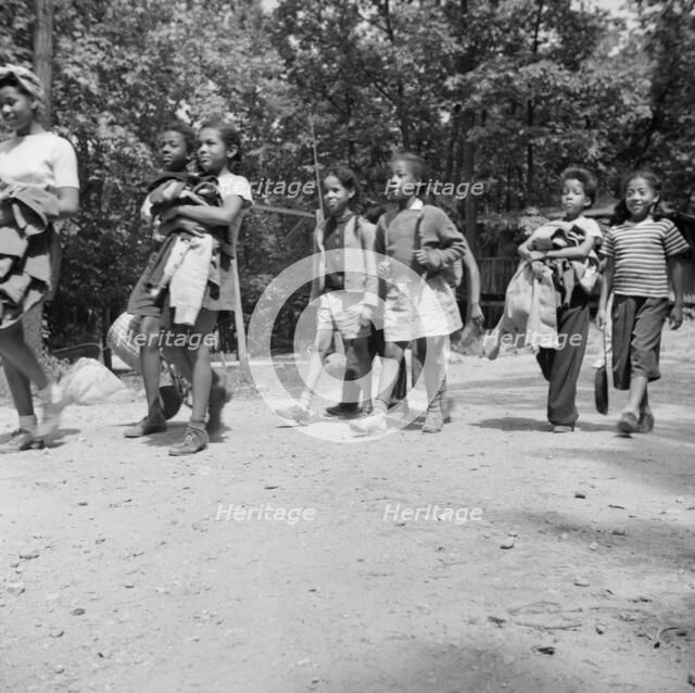 Campers returning from a day's hike at Camp Fern Rock, Bear Mountain, New York, 1943 Creator: Gordon Parks.