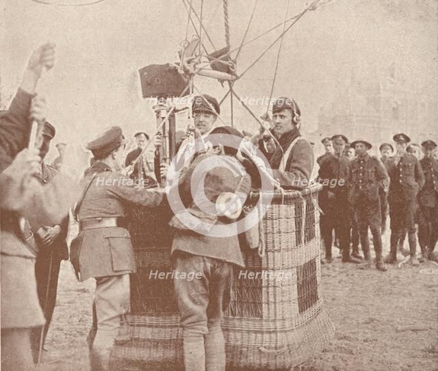 Canadian official cinematographer and assistant ready to ascend in a kite balloon, c1917 (1919). Artist: Unknown.