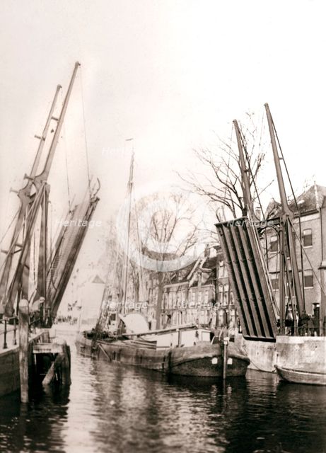 Canal bridge and boats, Dordrecht, Netherlands, 1898.Artist: James Batkin