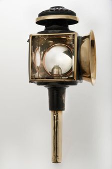 Candle powered carriage lamp 1900. Creator: Unknown